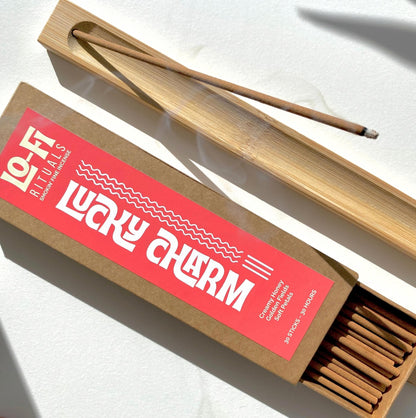 Lo-Fi Rituals classic kraft box with bright, bold modern label stating 'Lucky Charm' creamy honey, floral incense
